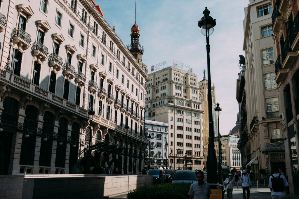 Buildings line a city street in a european city.
